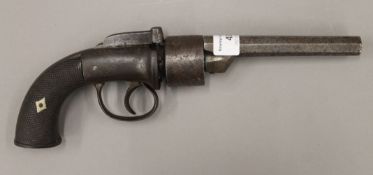 A transitional six shot percussion revolver by Smith of London. 29.5 cm long.