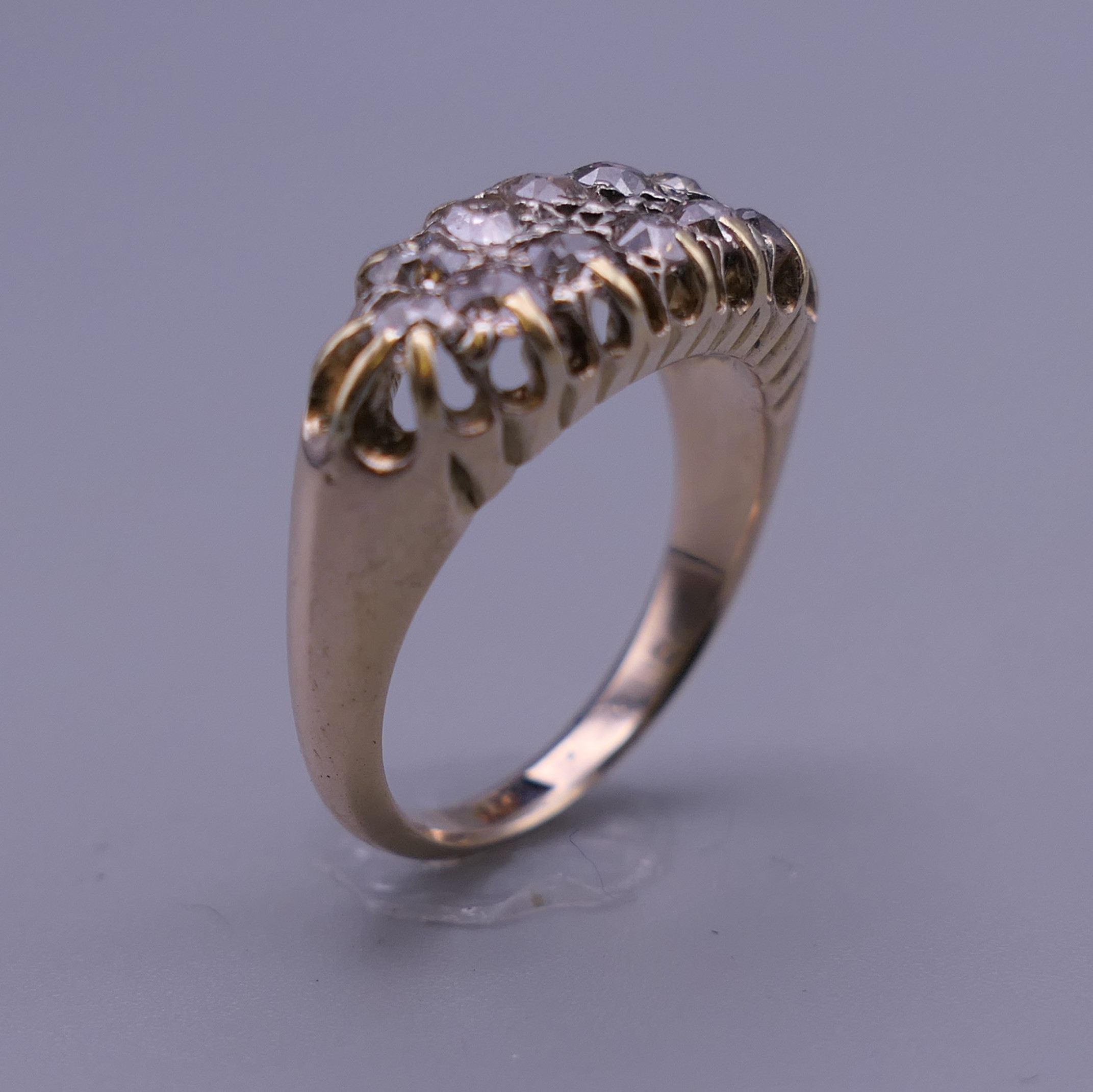 An 18 ct gold and diamond ring. Ring size O/P. 6 grammes total weight. - Image 6 of 9