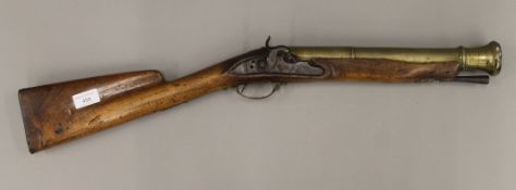 An early 19th century percussion brass barrel blunderbuss (converted from flint lock). 72 cm long.