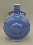 A Chinese blue porcelain moon vase. 35 cm high.