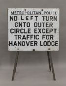 A Metropolitan Police enamel sign on a framed stand. 70 cm wide.