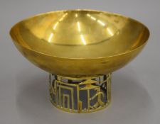 A Hagenauer brass footed bowl decorated with golfers. 19.5 cm diameter.