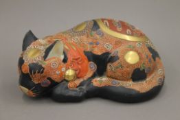 A Japanese Satsuma model of a cat. 25 cm long.