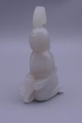 A white jade figural carving. 9 cm high.