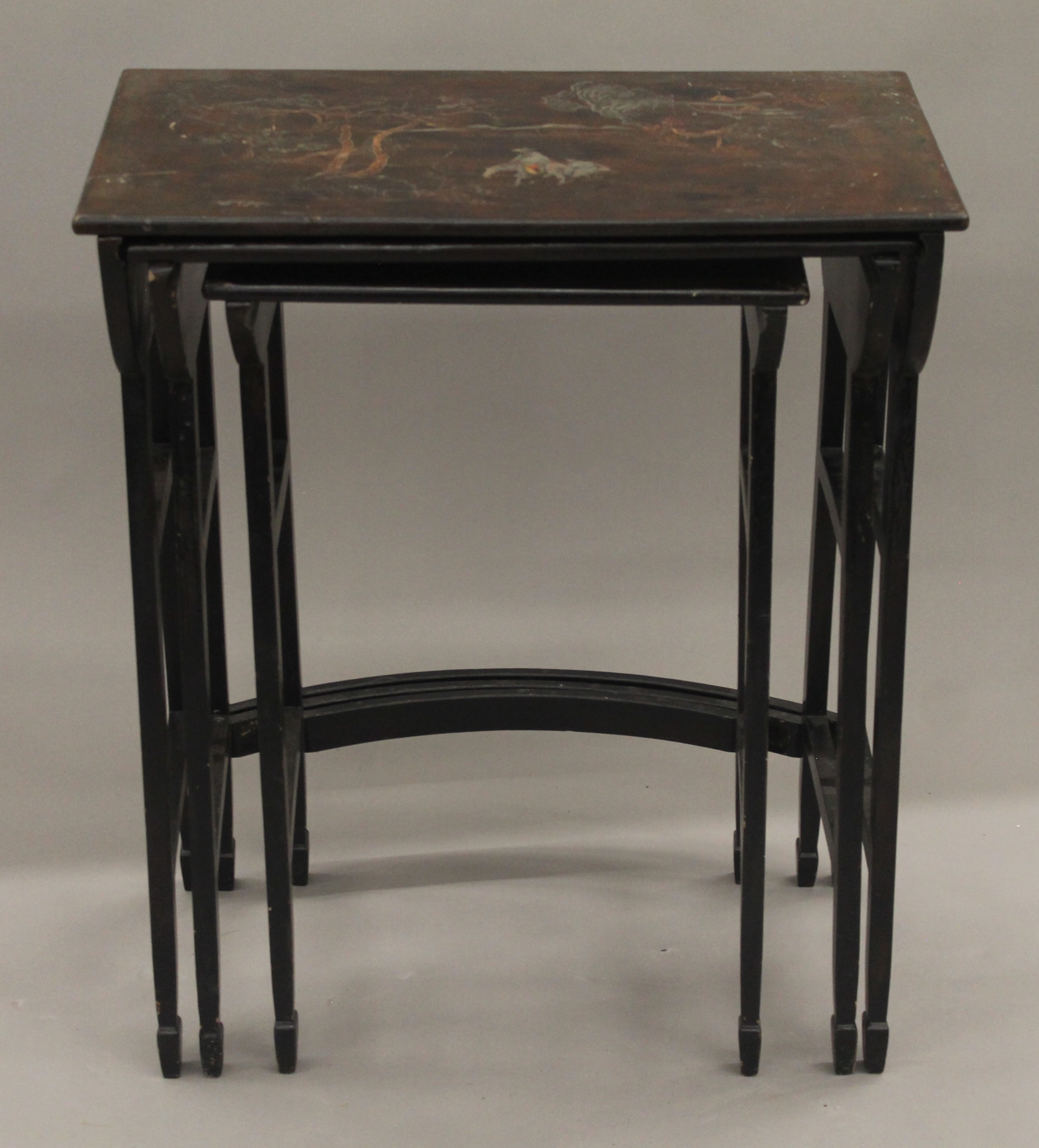 A set of nest of three Oriental lacquered tables. 58.5 cm wide.