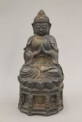 A bronze model of Buddha. 29 cm high.