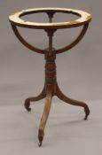 A 19th century mahogany globe stand. 52 cm diameter.