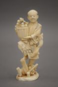 A 19th century Japanese carved ivory okimono formed as a farmer. 13 cm high.