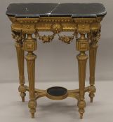 A marble topped gilt console table. 78.5 cm wide.