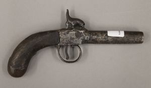 A 19th century percussion pocket pistol. 17 cm long.