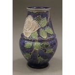 A Royal Doulton florally decorated vase. 19 cm high.