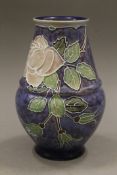 A Royal Doulton florally decorated vase. 19 cm high.