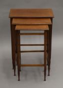 An Edwardian mahogany nest of three tables. 49 cm wide.