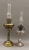 A silver plate and glass oil lamp, and a brass oil lamp. The former 35 high excluding chimney.