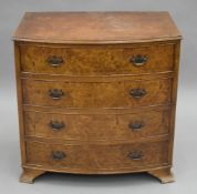 A 20th century burr walnut bowfront chest of drawers. 74.5 cm wide.