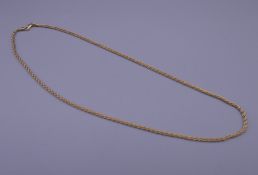 An 18 K gold necklace. 46 cm long. 12.1 grammes.