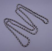 A long silver plated chain. 148 cm long.