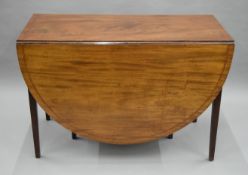 A 19th century mahogany drop leaf table. 108 cm wide x 162 cm long.