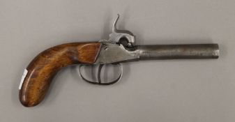 A 19th century percussion pocket pistol with dolphin hammer. 19.5 cm long.