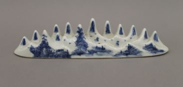 A Chinese blue and white porcelain brush rest. 27 cm long.