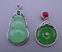 Two jade dress pendants. The largest 5.5 cm high.