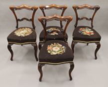 A set of four Victorian rosewood dining chairs. 48 cm wide.