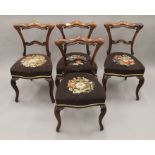 A set of four Victorian rosewood dining chairs. 48 cm wide.