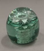 A glass dump paperweight, stamped to base Kilner. 8 cm high.