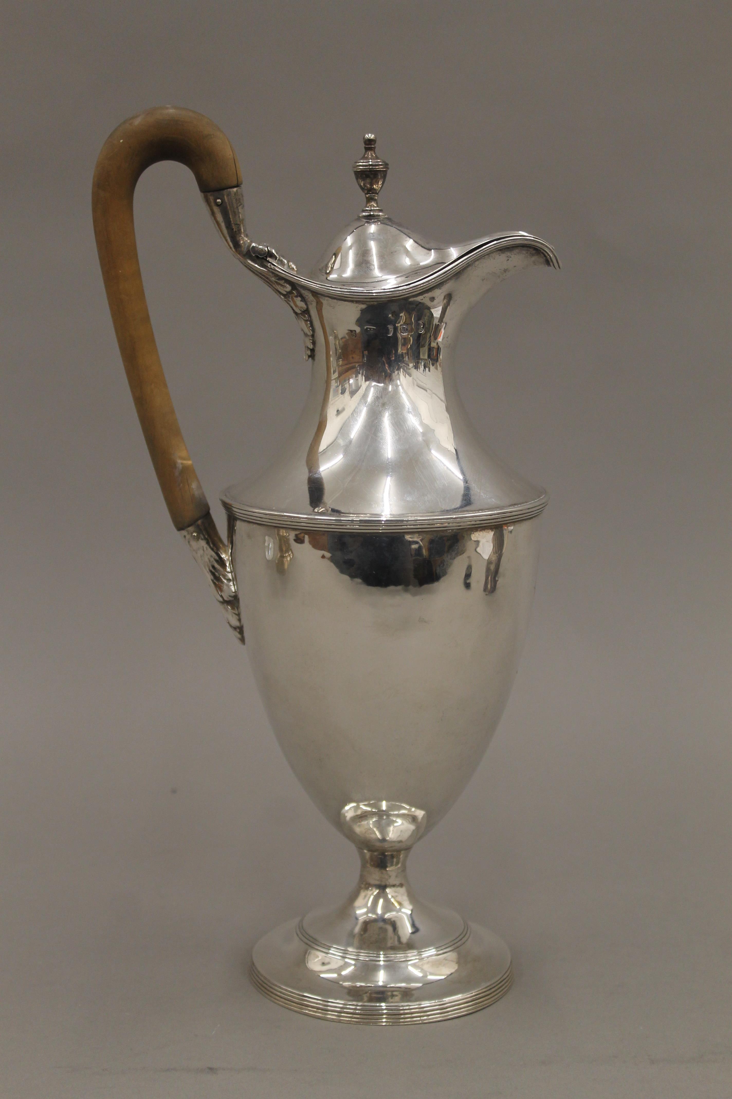 A Georgian silver hot water jug, makers mark of Hester Bateman. 31.5 cm high. 19. - Image 2 of 5