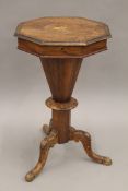 A Victorian walnut trumpet work table. 73 cm high.