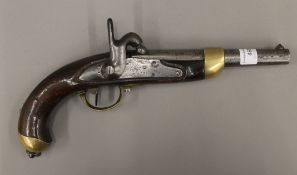 A 19th century percussion pistol. 35 cm long.