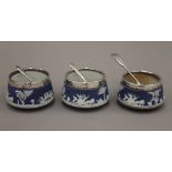 Three Wedgwood silver mounted salts. Each 6 cm diameter.