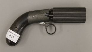 A 19th century six shot pepper box percussion pistol. 19 cm long.