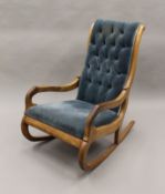 A Victorian mahogany framed button back rocking chair. 58.5 cm wide.