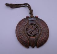 A Chinese pendant. 7 cm wide.