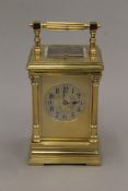 A brass cased repeating carriage clock. 19 cm high.