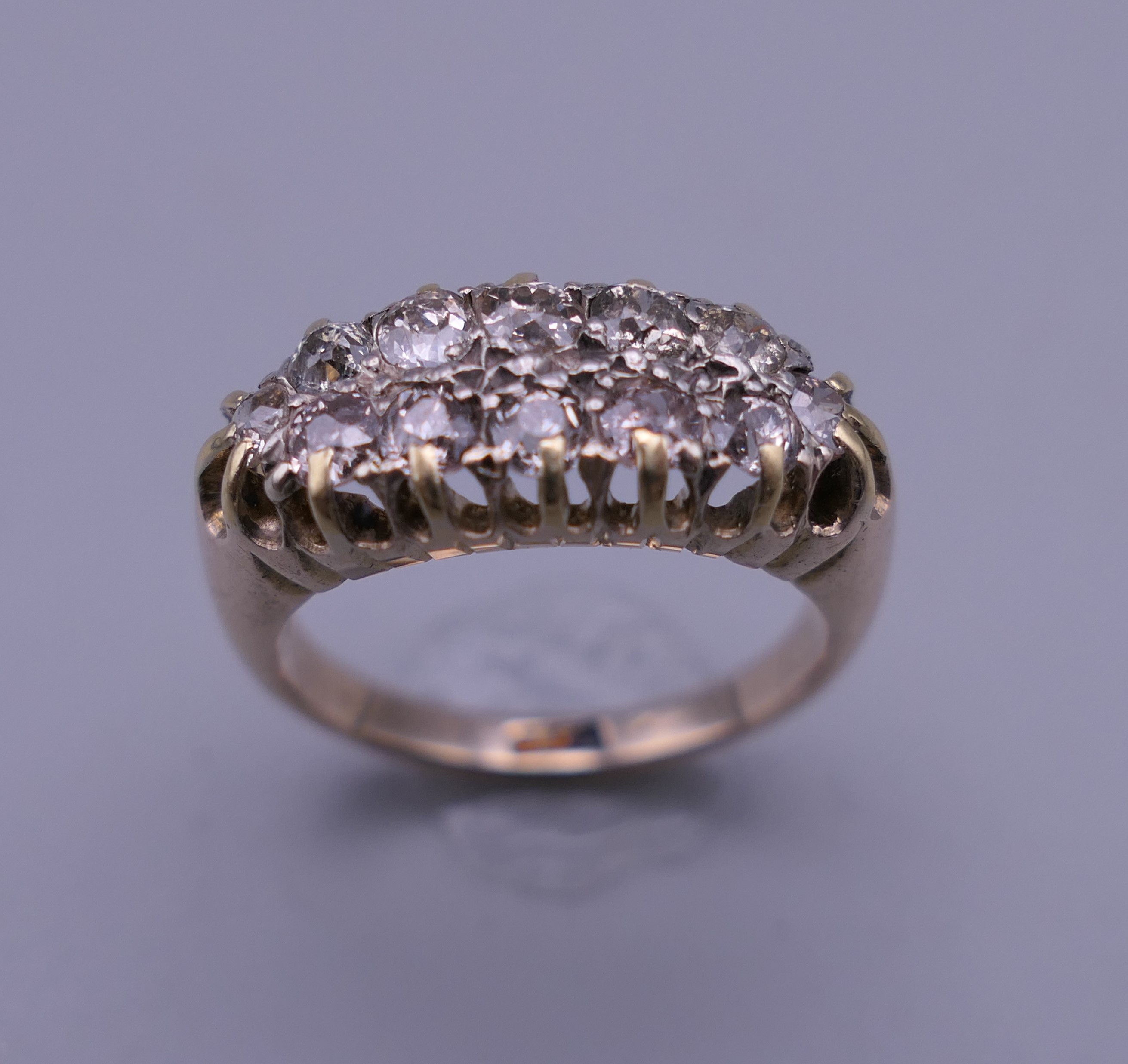 An 18 ct gold and diamond ring. Ring size O/P. 6 grammes total weight. - Image 2 of 9