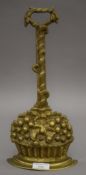 A brass doorstop. 36 cm high.