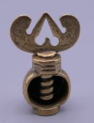 A Charles II period brass nutcracker with seal. 5 cm high when closed.