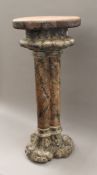 A trefoil shaped marbled carved wooden torchere. 81.5 cm high.