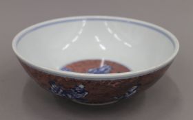 A Chinese red and blue porcelain bowl. 22.5 cm diameter.