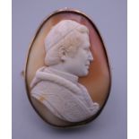 A 19th century unmarked gold framed cameo brooch carved as Pope Pius IX, signed Finet. 5.5 cm high.