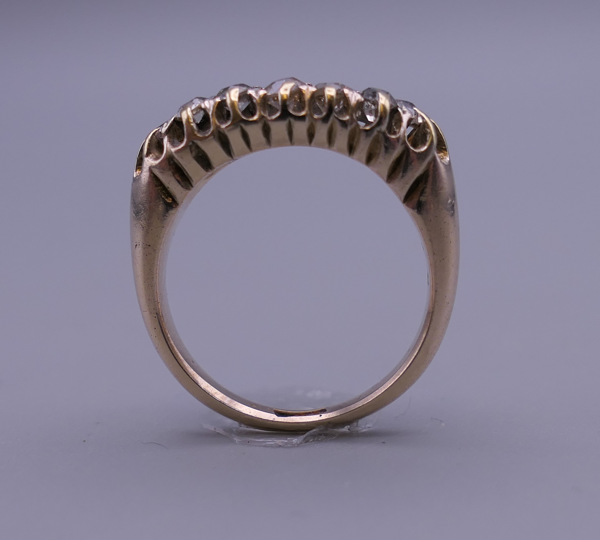 An 18 ct gold and diamond ring. Ring size O/P. 6 grammes total weight. - Image 8 of 9