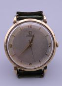 A 9 ct gold Omega Automatic wristwatch on an Omega strap, calibre 501, 14 million serial. 3.