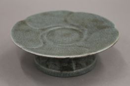 A small Chinese celadon pedestal tazza. 13.5 cm diameter.