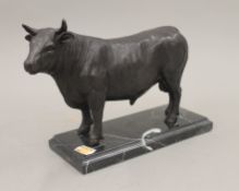 A bronze model of a bull. 17.5 cm high.