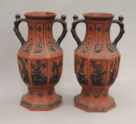 A pair of classical terracotta vases. 30 cm high.