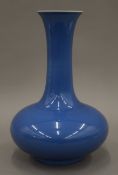 A Chinese blue porcelain vase, the underside with six character mark. 33 cm high.