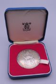 A silver 1952-77 medallion in Royal Mint box.