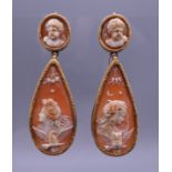 A pair of 18th/19th century unmarked gold mounted cameo drop earrings. Each 6 cm high.